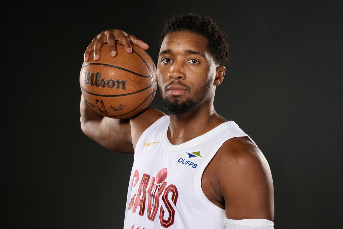 Donovan Mitchell smiling during NBA press conference in 2025 offseason